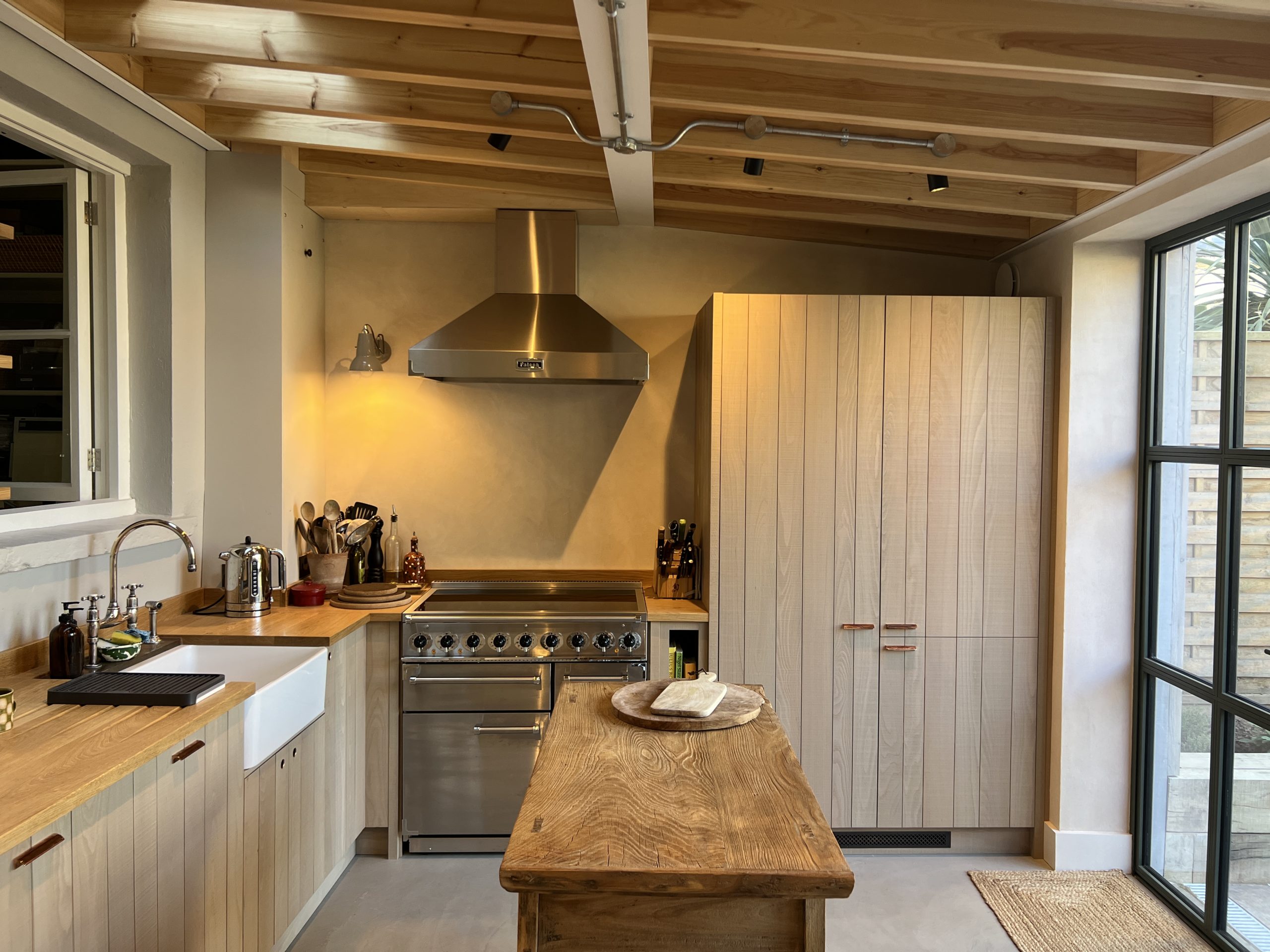Modern kitchen with wooden cabinets and island. Royal Hill Rear Extension Interior Shot of contemporary kitchen